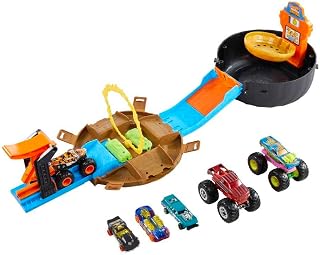 Hot Wheels Monster Trucks Stunt Tire Bundle, Ages 4+ | Tire-Shaped Case Transforms into Race Course, Includes 3 Toy Monster Trucks & 4 Cars​​ in 1:64 Scale (Amazon Exclusive)