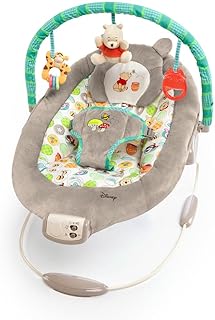 Bright Starts Disney Baby Winnie the Pooh Baby Bouncer Soothing Vibrations Deluxe Infant Seat - Faux Suede, Music, Removable -Toy Bar, 0-6 Months 6-20 lbs (Dots &amp; Hunny Pots)