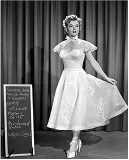 Marilyn Monroe 8x10 Photo Some Like It Hot The Seven Year Itch Gentlemen Prefer Blondes B&W Holding Skirt of Dress Out w/Left Hand Next to Chalkboard Curtain in Background kn