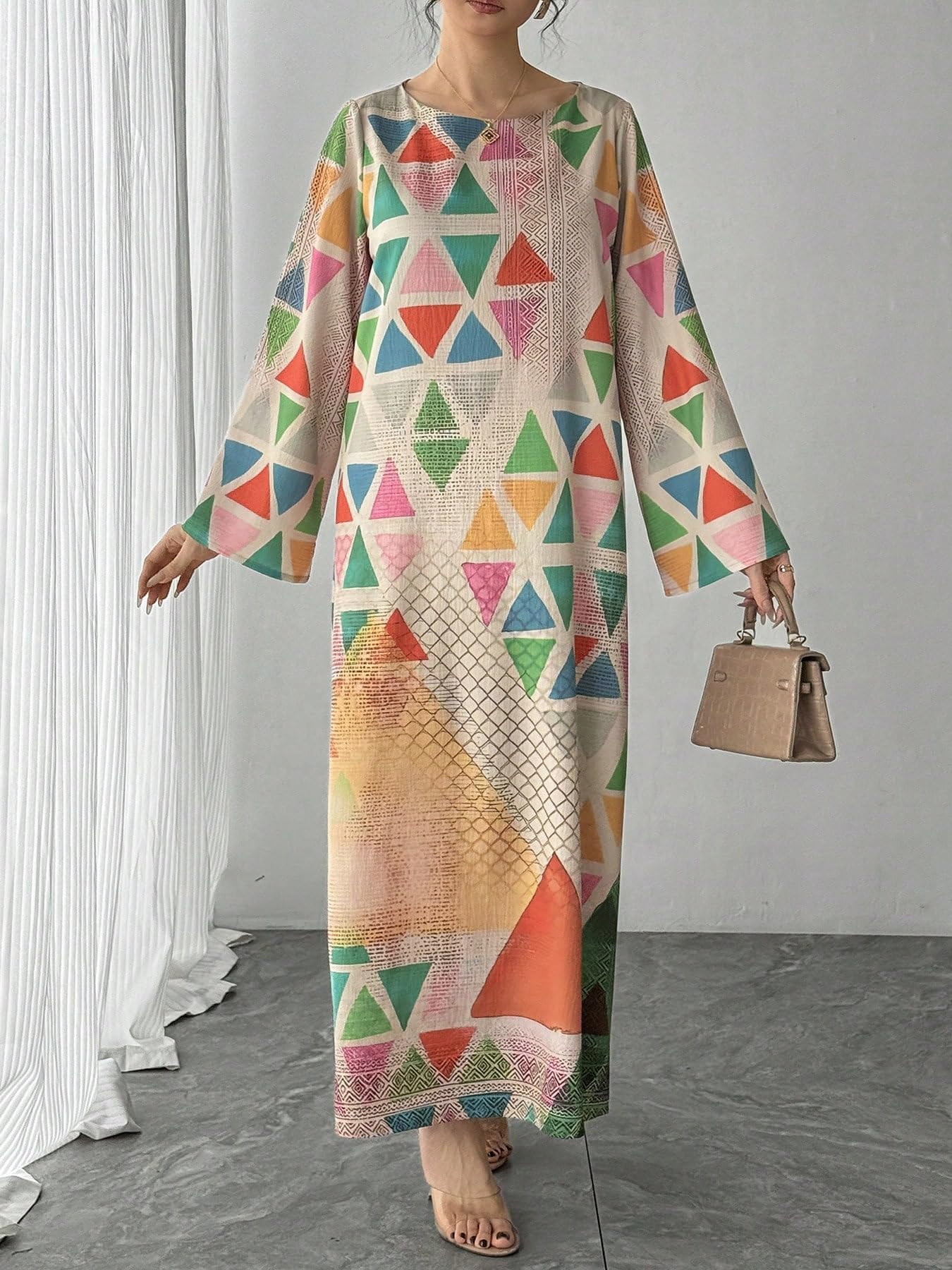 Elegant long sleeve kaftan dress with eye-catching multicolored abstract pattern